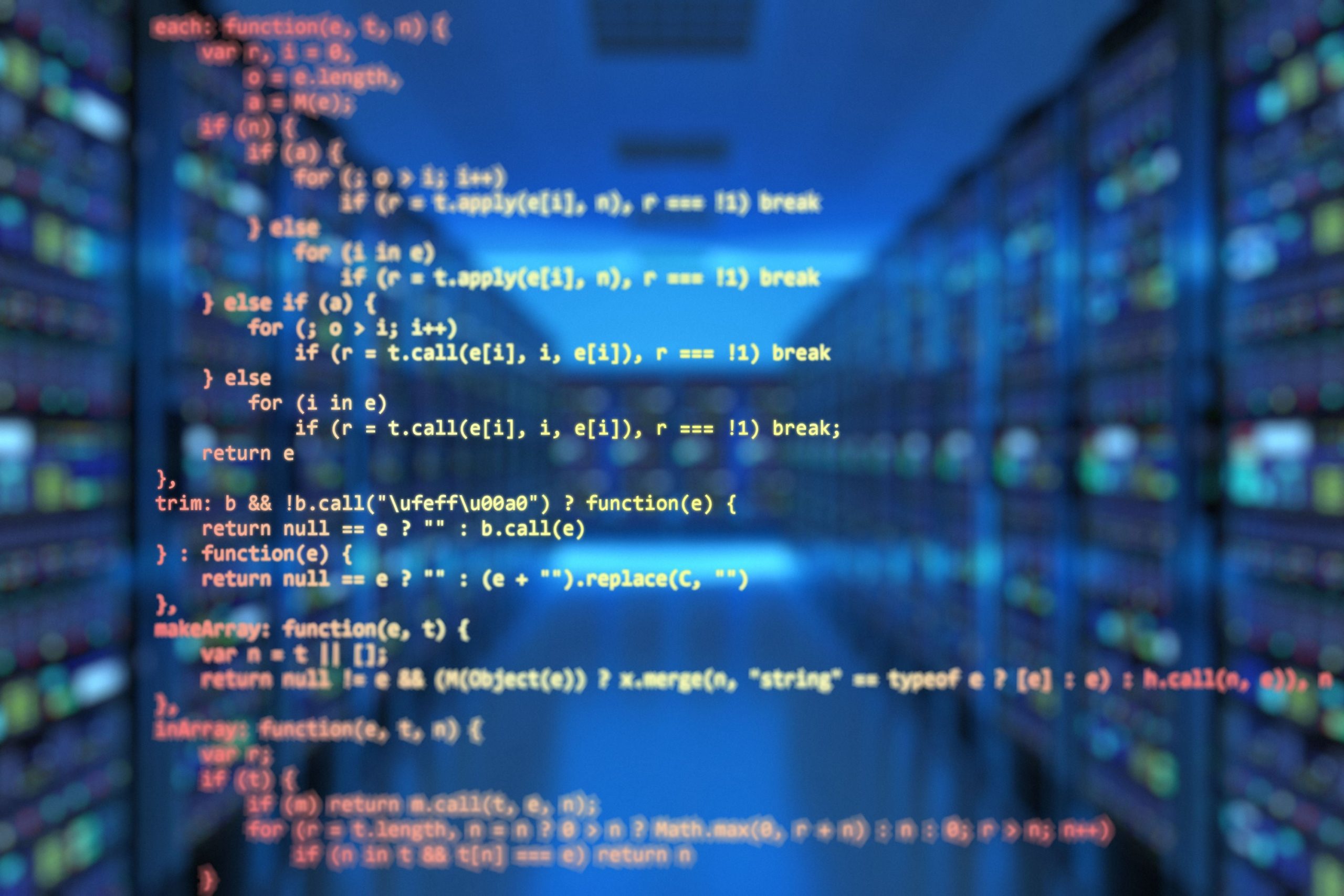 Blurred computer code appears over a modern data center filled with server racks, symbolizing artificial intelligence, machine learning, big data analytics, and advanced computing. The image represents professionals pursuing applied AI and data science credentials, technical training, and industry-focused education in 2026.