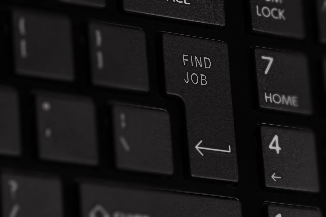 Close-up of a computer keyboard featuring a custom "Find Job" key, symbolizing online job searching, career opportunities, and the digital job application process.
